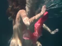 Two delicious and luscious Russian teenagers taking off their clothes in the swimming pool